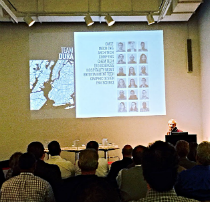 Team DURA presenting the project, with a slide of the DURA site map, at Building Energy NYC